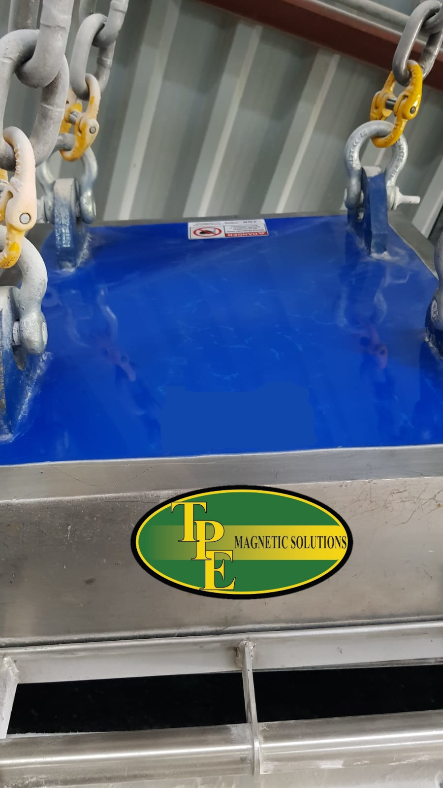 Suspended overbelt magnet